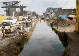Stream of Unconsciousness: Rainwater has mixed with sewage in this drain along the national highway in Zirakpur. — Tribune photo by Manoj Mahajan