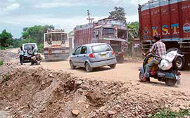 Vehicles ply on the alternative Kandwal-Lodhwan road, after the collapse of the Chakki bridge.