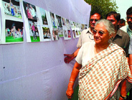 Delhi CM Sheila Dikshit goes around the photo exhibition after opening porta cabins in the DIZ area of Gol Market in the Capital on Saturday.