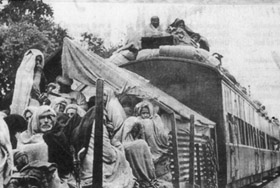 A train overloaded with refugees from either side of the border during the Partition