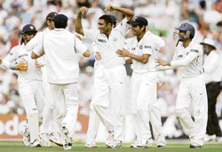 Anil Kumble (centre) celebrates with team-mates after taking the wicket of England captain Michael Vaughan on the third day of the final Test at the Oval in London on Saturday.  AP/PTI photo