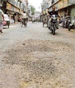A road near Raikhy cinema that has worn out in Ludhiana on Sunday.