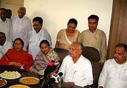 Haryana Congress chief Phool Chand Mullana and working president Kuldeep Sharma addresses a press conference at Hisar on Sunday.
