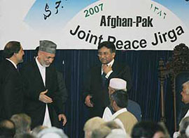 Pakistan President Pervez Musharraf and Afghanistan President Hamid Karzai meet delegates of a joint peace meeting in Kabul on Sunday.