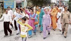 Residents of McLoedganj on their way to the deputy commissioners office on Monday for submitting a memorandum protesting against attacks by Tibetan youths