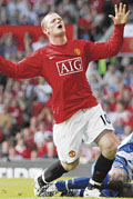 Manchester United's Wayne Rooney reacts after missing a chance to score during their English Premier League soccer match against Reading in Manchester, northern England.