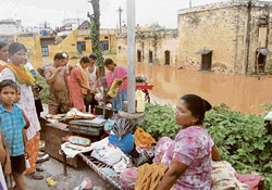 Villagers retrieve whatever possible after water again entered their houses in Anandpur Sahib subdivision.