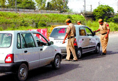 Delhi Police personnel check vehicles to ensure incident-free Independence Day celebrations in the Capital on Wednesday.