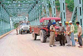 In view of the security alert in connection with Independence Day, CISF staff check vehicles at Maitri Setu constructed by the 800-MW Kol Dam authorites across the Sutlej, on Tuesday evening.