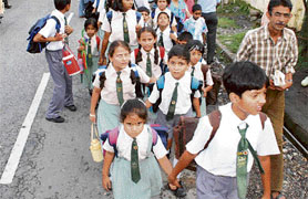 Children trudge to their schools owing to the taxi strike.