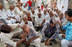 People of Malcha village in Sonepat get their hair shaved on Thursday as a mark of protest for not compensating them for the land on which Rashtrapati Bhavan stands. These people claim to be the original owners of the land.