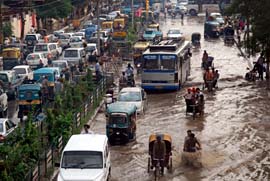 Commuters suffered as clogged drains led to major traffic jams. Strong winds also uprooted trees at many places.
