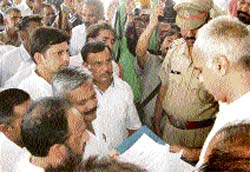 INLD workers submit a memorandum to Haryana Governors ADC Parveen Kumar in Panchkula on Friday.