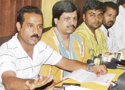 Businessman Rakesh Jain addresses a press conference in Ludhiana on Friday.