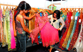 Women have a dekko at the latest designer wear during opening of the eighth Bride & Groom wedding exhibition in the Capital on Saturday.
