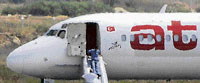 An unidentified man leaves the hijacked Atlasjet aircraft at Antalya airport on Saturday.