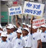 Students hold an awareness rally raising slogans on the occasion of Akshay Urja Diwas in Karnal on Monday.