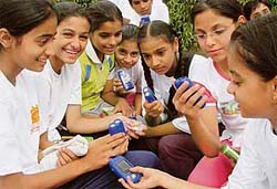 Participants of the Akshay Urja Run organised by the renewable energy department inspect the torches distributed to them in Panchkula on Monday