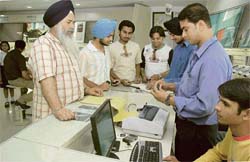 Nokia customers get their handset batteries checked at a retail outlet in Ludhiana.
