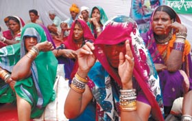Women from Madhya Pradesh demand a better deal for auxiliary nurses and midwives at Jantar Mantar in the Capital on Tuesday. 