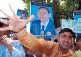 Boxers demonstrate to protest against not considering boxing coach Jagdish Singh for the Dronachariya Award , at Parliament Street in the Capital on Tuesday.