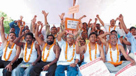 Activists of All India Central Govt. Health Scheme Employees Association (CGHS) sitting on dharna for their various demands, at Jantar Mantar in New Delhi on Tuesday. 