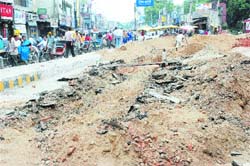 Residents have a tough time crossing Jyoti Chowk as one side of the road has been dug up for laying sewerage pipes. The work has been going on at a snails pace for the past many days