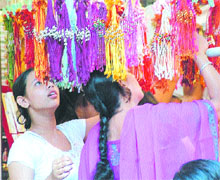 Girls take their pick from colourful rakhis at a shop in Jalandhar on Tuesday.