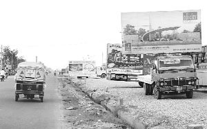 Trucks loaded with illuminating hoardings pose serious threat as they distract the attention of motorists along the G.T. Road in Karnal.