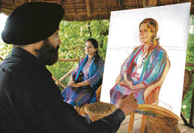 Renowned artist Kulwant Singh works on a portrait during a three-day national painting workshop at Potters Hills in Shimla on Wednesday.