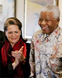 Former South African President and Nobel Peace Prize laureate Nelson Mandela receives Sonia Gandhi at the Mandela Foundation in Johannesburg