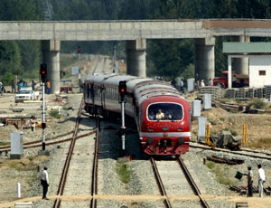 A train makes its way from Budgam railway station in central Kashmir, 15 km from Srinagar, as part of 35 km trial run between Budgam and Kakapora on Thursday.
