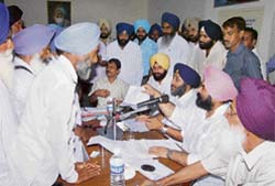 Sukhbir Badal, SAD officiating president, along with Bikramjit Singh Majithia, public relations minister, interact with panchayat members in Faridkot