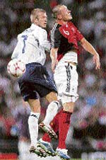 Englands David Beckham (left) fights for the ball with Germanys Christian Pander during the friendly football match at the Wembley Stadium in London