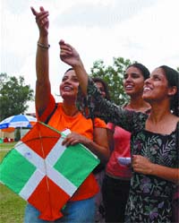 Students of Delhi University enjoying the Kite flying during the Inter University Kite flying championship to promote Kite flying as a sports actvity at Sri Guru Bahadur Khalsa College,North Campus,Delhi University, in the Capital on Friday.