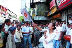 Volunteers of an NGO Mission perform a street play based on HIV/ AIDS awareness at GB Road in the Capital on Friday.