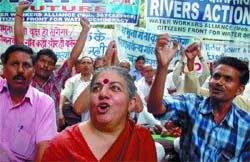 Environmentalist Vandna Shiva and other activists protest against the Commonwealth Games site in the Yamuna riverbed at Jantar Mantar in the Capital on Friday. 