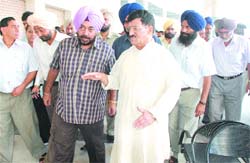 Transport minister Mohan Lal during his surprise visit to the bus stand