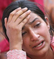A girl wails over the brutal killing of a nine-year-old girl, Sabrina Fayaz, at Ikhrajpora locality of Srinagar on Friday. The girl went missing from the locality on Thursday afternoon and was found dead in an abandoned house.