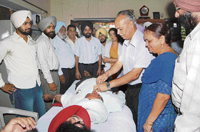 S.K. Alhuwalia Commissioner Patiala division talking with blood donors on a camp at Bhadson (Amloh) village
