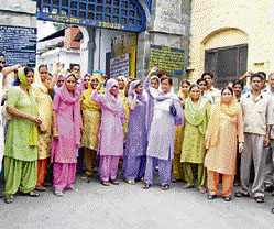 Irate residents of Sakoh village hold a demonstration in protest against police inaction in front of Nurpur police station on Sunday.