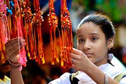 A girl selects rakhis in Jammu on Sunday.