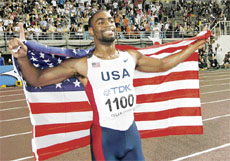 Tyson Gay of the USA celebrates after winning the mens 100m gold at the 11th IAAF World Athletics Championships in Osaka on Sunday.