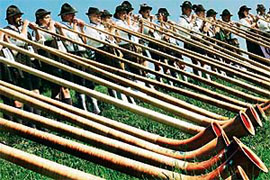 Alphorn players blow awakening songs for sunrise in Engetried, southern Germany, on Sunday.