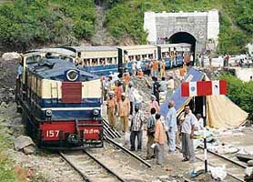 The Shimla-Kalka train at Koti railway station on the first day of the repaired track on Monday. The track was washed away in this month due to heavy rain.