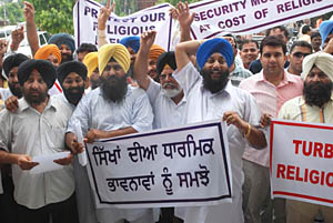 Sikhs protest against proposed US law on turbans in Jalandhar on Monday.