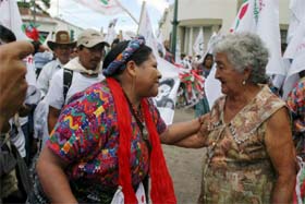 Nobel Prize-winner and presidential candidate Rigoberta Menchu (left) is greeted by a supporter during the close of her campaign in Guatemala City