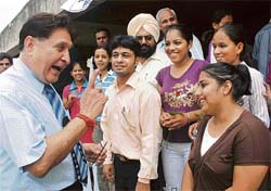 Panjab University vice-chancellor R.C. Sobti talks to students during a function to mark National Sports Day in Chandigarh 
