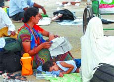As the strike of AIIMS resident doctors continues, patients and their attendants wait on the premises of the medical institute in the Capital on Wednesday. 