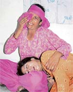 The grieving mother (lying in the lap of a relative) of four-year-old Dinesh, who died on the way to hospital in Shimla 